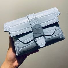 An Upgraded Version Of The Classic Fanny Pack. Features 3 Interior Pockets That Can Fit Up To An Iphone 11 Plus. Wear It As A Belt Bag, A Sling Bag, A Crossbody, Or A Clutch. Patented For Design And Utility. Want Even More Ways To Wear? Swap In A Metal Chain Strap For An Elegant Upgrade. Details Made In Italy 100% Genuine Italian Leather That Is Scratch, Stain, And Water Resistant Supple, Stain-Resistant Micro-Suede Interior Patented For Design And Utility Secured By A Flap Closure With A Magnet Elegant Light Blue Bag For Daily Use, Elegant Light Blue Crossbody Bag, Elegant Light Blue Office Bag, Light Blue Rectangular Shoulder Bag For Formal Occasions, Elegant Light Blue Shoulder Bag For Travel, Light Blue Evening Shoulder Bag, Elegant Light Blue Rectangular Shoulder Bag, Modern Light Blue Evening Bag, Elegant Light Blue Shoulder Bag With Adjustable Strap