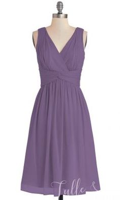 a purple bridesmaid dress on a mannequin