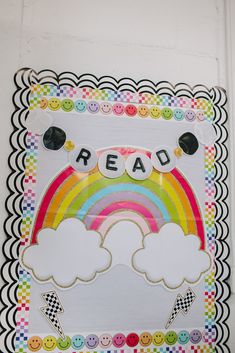 a paper cut out with the word read on it and a rainbow in the middle