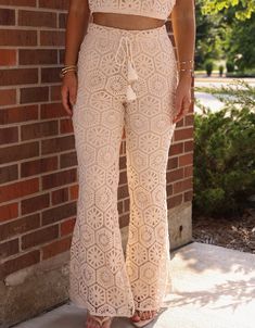 Get ready for the end of summer with our Sand And Sea Bell Bottoms! These stylish flared pants feature a unique crochet pattern that will elevate your beach look. Stay on-trend as you head to the shore in these versatile and comfortable bell bottoms. Pair with our Sun and Sea Top! Fabric 100% rayon Lining 100% polyester Beachy White Bottoms For Festival, Beach Bottoms With Crochet Trim, Beachy Bottoms With Crochet Trim For Beach, Bohemian Bottoms For Beach Party In Spring, White Crochet Lace Bottoms For Vacation, Summer Beach Bottoms With Crochet Trim, Bohemian Summer Bottoms With Crochet Trim, Bohemian Bottoms With Crochet Trim For Summer, Summer Beachwear Bottoms With Crochet Trim