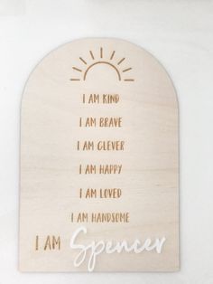 a wooden plaque with the words, i am kind of brave and i am clever