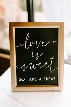 a black and white sign that says love is sweet so take a treat on it