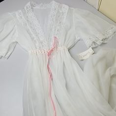 Off White Dreamy Vintage Mesh And Lace Long Gown, Size Medium, Pink Flowers On Top Front Lace Mesh, Cinched On Waist With Pink Lace, Flowy Long See Through Gown, Overall In Great Vintage Conditions, Please Look At Pics Before Ordering If Any Questions Please Ask Down Below, It Has A Tiny Stain That Probably Would Come Off With Wash. White Lace Bedding, Lace Long Gown, Lace Bedding, Victoria Secret Pajamas, Black Lace Bra, Lace Tunic, Long Gown, Cinched Waist, Lace Bralette