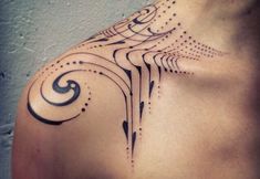 a woman's shoulder with an intricate design on it