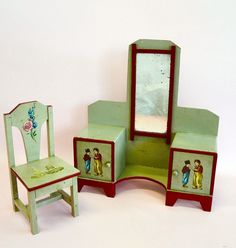 an old dollhouse furniture set with a mirror and chair