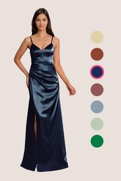 a woman in a long blue dress standing next to an assortment of color swatches