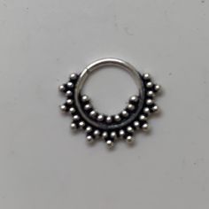 "These are so pretty and light. Made is 925 sterling silver with tribal details. The rings are all 10mm (1cm or .40\") in diameter. The wire is 18 gauge. They are only finished on one side since each one is made BY HAND so there may be very slight differences. One of the images contains numbers to specify which you would like from the drop down menu." Nickel Free Silver Piercings, Nickel Free Round Silver Piercings, Nickel-free Round Silver Piercings, Bohemian Nickel-free Round Septum Ring, Adjustable Round Bohemian Nose Rings, Nickel-free Silver Bohemian Septum Ring, Bohemian Silver Nickel-free Septum Ring, Bohemian Nickel-free Silver Septum Ring, Nickel Free Silver Rings For Festival