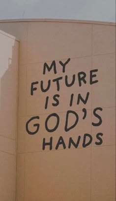 the words my future is in god's hands are spray painted on the side of a building