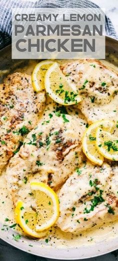 chicken with lemons and parmesan sauce in a skillet on a table