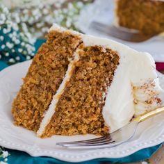 a slice of carrot cake on a plate with a fork