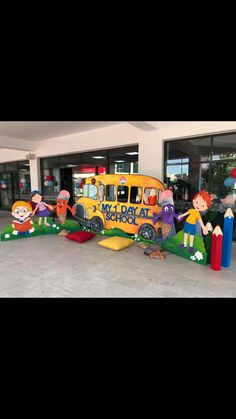 an inflatable school bus with children on it