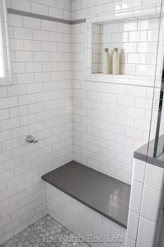 great idea to add the extra hand held shower holder back by the shower bench. I like the placement of the shower niche too! The North End Loft: August 2014 Restroom Ideas, Gray Grout, Tiled Bathroom, Subway Tile Showers, Master Shower, Shower Niche, Master Bath Remodel, Shower Bench