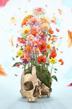 a painting of flowers in a vase with a human skull on the ground next to it