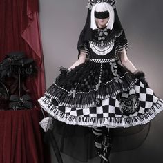 A dark and mysterious young lady. An elegant item that combines a black and white block check pattern with a piano keyboard pattern. Decorated frills and ribbons are intricately and architecturally deployed. You will be captivated by the dramatic impact, as if an elegant melody is being played. 
 
 
 
 What is included in your order 
 
 One Piece 
 Headband 
 Headdress 
 Gloves 
 Tights 
 
 
 Size(*Dress) 
 
 S size 
 
 Length: 100cm 
 Bust: 84cm 
 Waist: 72cm 
 
 M size 
 
 Length: 101cm 
 Bust Comme Si, Dresses Xxl, Gothic Dress, Check Pattern, Xl Dress, Headdress, No Frills, Keyboard, Piano