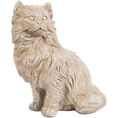 a white cat statue sitting on top of a table