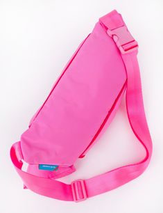 Our Fanny Sling is the cross body bag you've been waiting for! This silhouette hugs your body in all the right places and is the perfect medium size that will hold your necessities without weighing you down. Features super soft match nylon webbing, tonal piping details, match buckle, a padded exterior for extra comfort and insulation, 3 separate zipper compartments, and two additional pockets in the main compartment. Coordinating paracord pulls make opening this bag a cinch! Comes with a matchin Pink Nylon Bag With Adjustable Straps, Sporty Nylon Belt Bag For On-the-go, Pink Nylon Shoulder Bag For Outdoor, Pink Nylon Shoulder Bag For Sports, Pink Nylon Sports Shoulder Bag, Nylon Crossbody Bag With Water Bottle Pocket, Nylon Belt Bag With Detachable Strap For Travel, Travel Nylon Belt Bag With Detachable Strap, Functional Nylon Shoulder Bag With Adjustable Straps