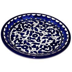 a blue and white bowl sitting on top of a table