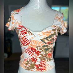 Brand New Front Twist Top, Tropical V-neck Top With Vibrant Print, Mint Blouse, Stretch Floral Print V-neck Top, Stretch Floral Print V-neck Blouse, Halter Neck Blouses, Multicolor Tropical Print V-neck Top, Polka Dot Tank Top, Tropical V-neck Floral Print Swimwear