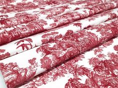 red and white fabric with trees on it