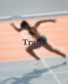 a woman running on a tennis court with the words track written in front of her