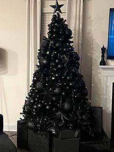 a black christmas tree in a living room