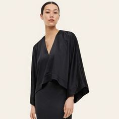 H&M Short, Loose-Fit Blouse In Woven Fabric With A Slight Sheen. Low-Cut V-Neck, Long, Wide Sleeves, And Short Slits At Hem. Modern V-neck Blouse For Spring, Versatile V-neck Viscose Blouse, Versatile V-neck Blouse For Night Out, Spring Viscose V-neck Top, Sleek Viscose Summer Tops, Sleek V-neck Tops For Spring, Versatile Black Viscose Blouse, Modern V-neck Blouse For Work, Modern V-neck Workwear Blouse