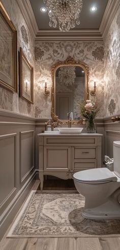 a bathroom with a toilet, sink and mirror in it's centerpieces