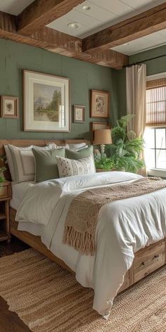 a bed sitting in a bedroom next to a window covered in green curtains and pillows