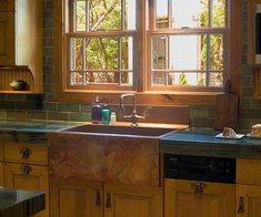 an image of a kitchen setting with the sun shining through the window and on the sink