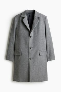 Single-breasted coat in a felted wool blend. Notched lapels and buttons at front. Front pockets with flap  welt inner pockets  and vent at back. Lined. Gray Wool Coat With Lapel Collar And Button Closure, Gray Wool Coat With Lapel Collar, Notched Outerwear With Welt Pockets For Fall, Gray Single-breasted Wool Coat With Lapel Collar, Notched Outerwear With Pockets For Business Casual, Gray Wool Single-breasted Outerwear, Wool Long Coat With Welt Pockets, Collared Wool Coat With Pockets, Gray Wool Coat With Lapel Collar For Work