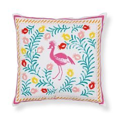 a pink flamingo embroidered on a white pillow with colorful leaves and flowers around it