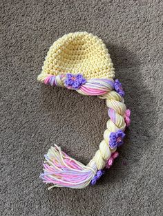 a crocheted hat laying on the floor