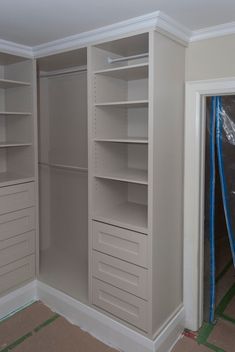 an empty walk in closet with no doors