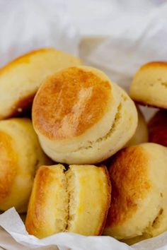 buttermilk biscuits are piled on top of each other with the words gluten free buttermilk biscuits above them