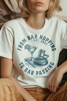 a woman sitting on a couch wearing a t - shirt that says from bar hopping to bar passing