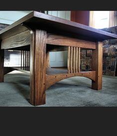 a wooden table sitting on top of a carpeted floor