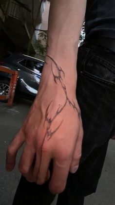 a person with a tattoo on their hand