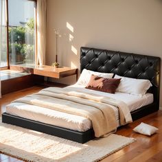 a large bed sitting on top of a wooden floor