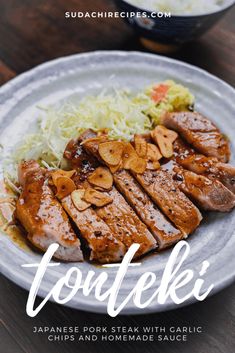 a plate with meat and vegetables on it that says foodeeki japanese pork steak with garlic, peppers and homemade sauce