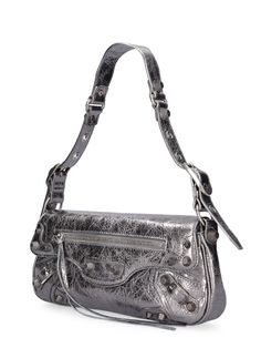 Height: 14cm Width: 30cm Depth: 4.5cm. Strap drop: 22cm. Adjustable strap. Front flap with magnetic button closure. Silver-colored metal hardware. One front zip pocket. One back zip pocket. One internal pocket Luxury Clutch Shoulder Bag With Gunmetal Hardware, Luxury Shoulder Clutch Bag With Gunmetal Hardware, Luxury Metallic Bags With Zipper Closure, Metallic Shoulder Bag For Evening With Zipper, Metallic Evening Shoulder Bag With Zipper Closure, Silver Leather Bag With Snap Closure, Luxury Shoulder Bag With Snap Closure, Luxury Evening Shoulder Bag With Snap Closure, Small Sling Bag