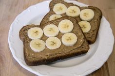 two slices of toast with banana slices on them