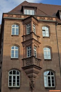 an old building with many windows on it