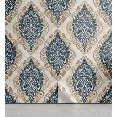 a blue and white wallpaper with an ornate design