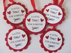 four little tags with hearts on them that say, a little treat for someone sweet