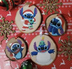 three ornaments are hanging on a table