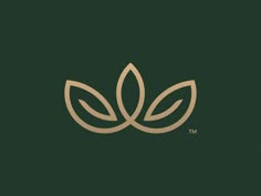 a green and gold logo with two leaves on the bottom, one leaf is brown