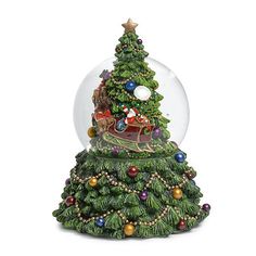 a snow globe with a christmas tree in the center and santa on his sleigh