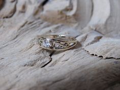 a close up of a ring on a rock