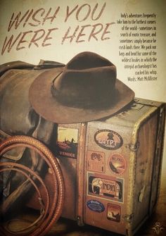 an old suitcase with a cowboy's hat and lasso on the front, which says wish you were here