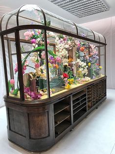 a display case filled with lots of flowers